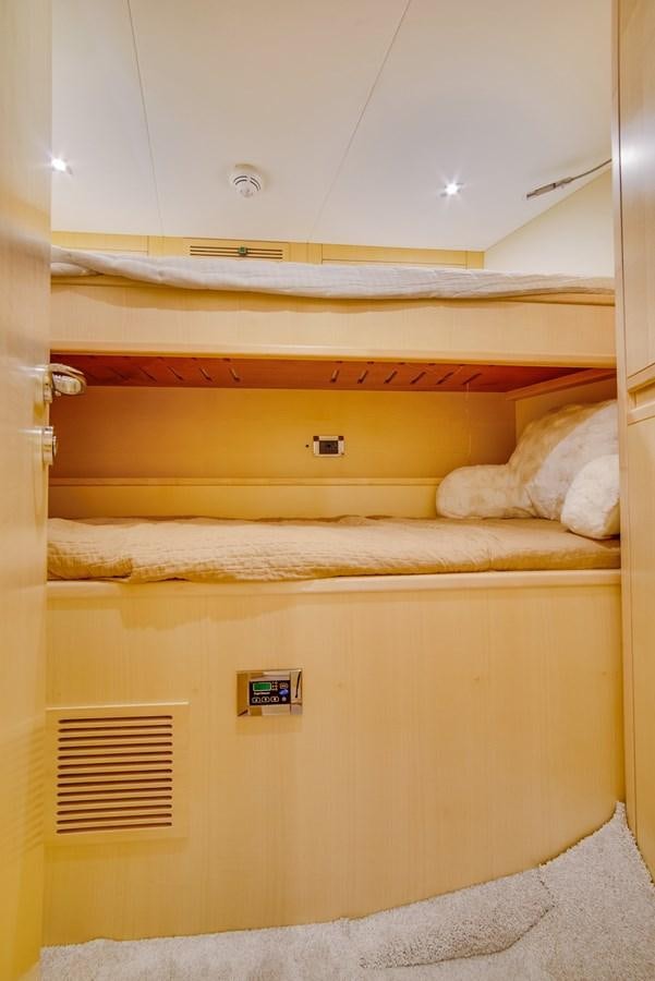 a bunk bed with a sign on the wall aboard GERRY'S FERRY Yacht for Sale
