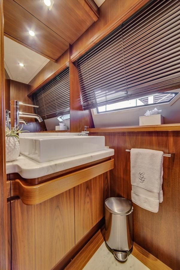 a bathroom with a sink and a mirror aboard GERRY'S FERRY Yacht for Sale