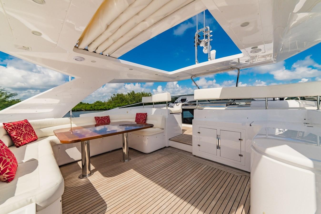 a room with a table and a couch aboard GERRY'S FERRY Yacht for Sale