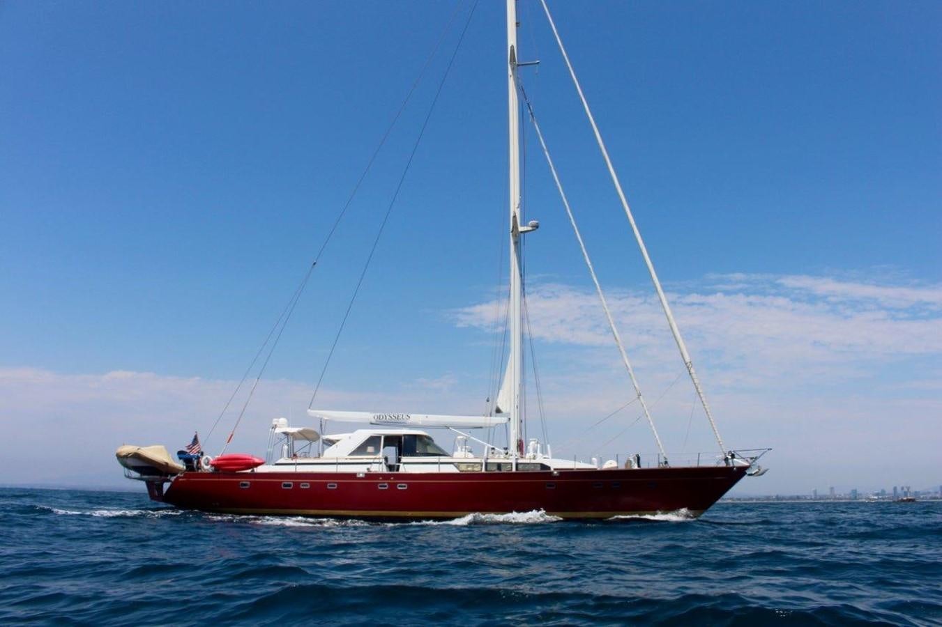 a red boat in the water aboard ODYSSEUS Yacht for Sale