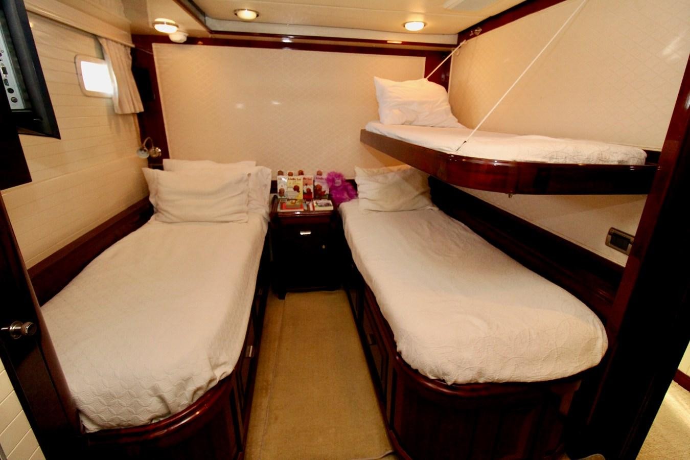 a room with two beds aboard ODYSSEUS Yacht for Sale