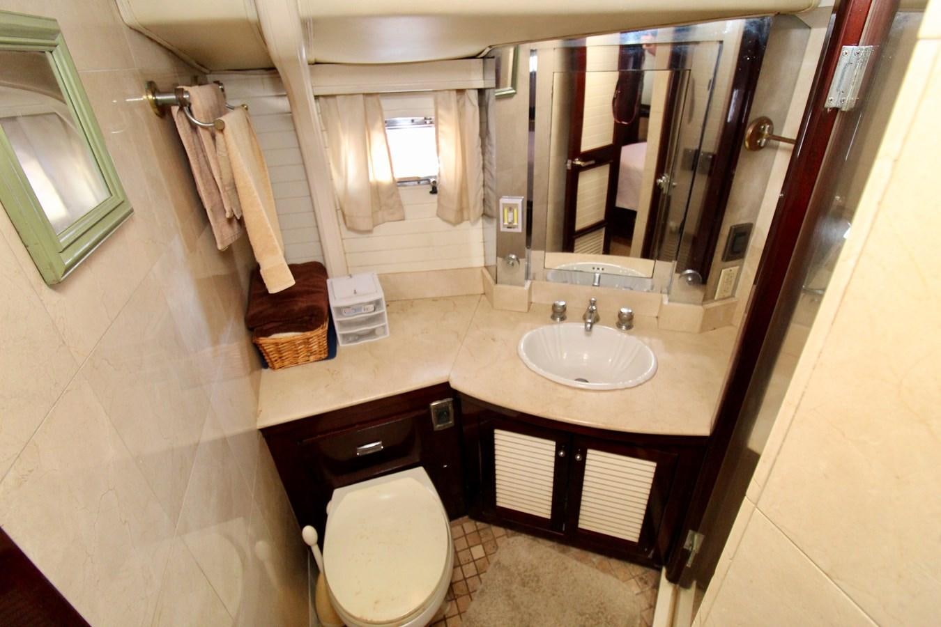 a bathroom with a sink and toilet aboard ODYSSEUS Yacht for Sale
