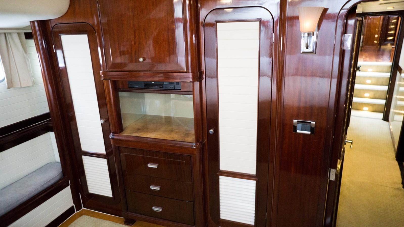a room with wooden cabinets aboard ODYSSEUS Yacht for Sale