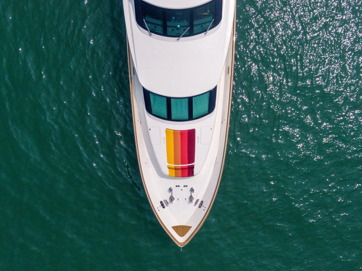 a white object with a red stripe on it on a green surface aboard VICTORIOUS Yacht for Charter