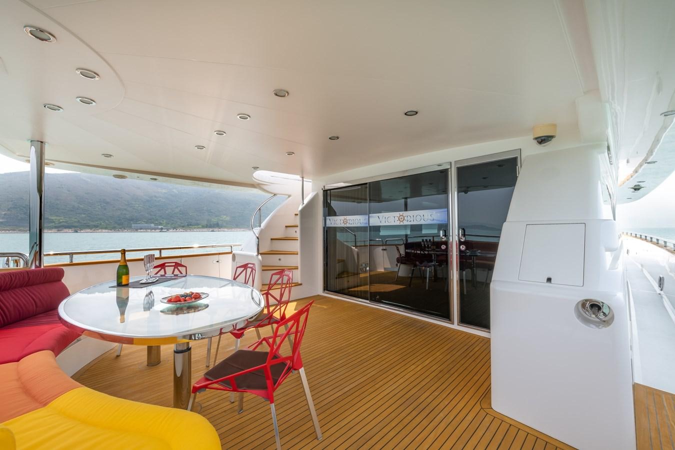 a room with a table and chairs aboard VICTORIOUS Yacht for Charter