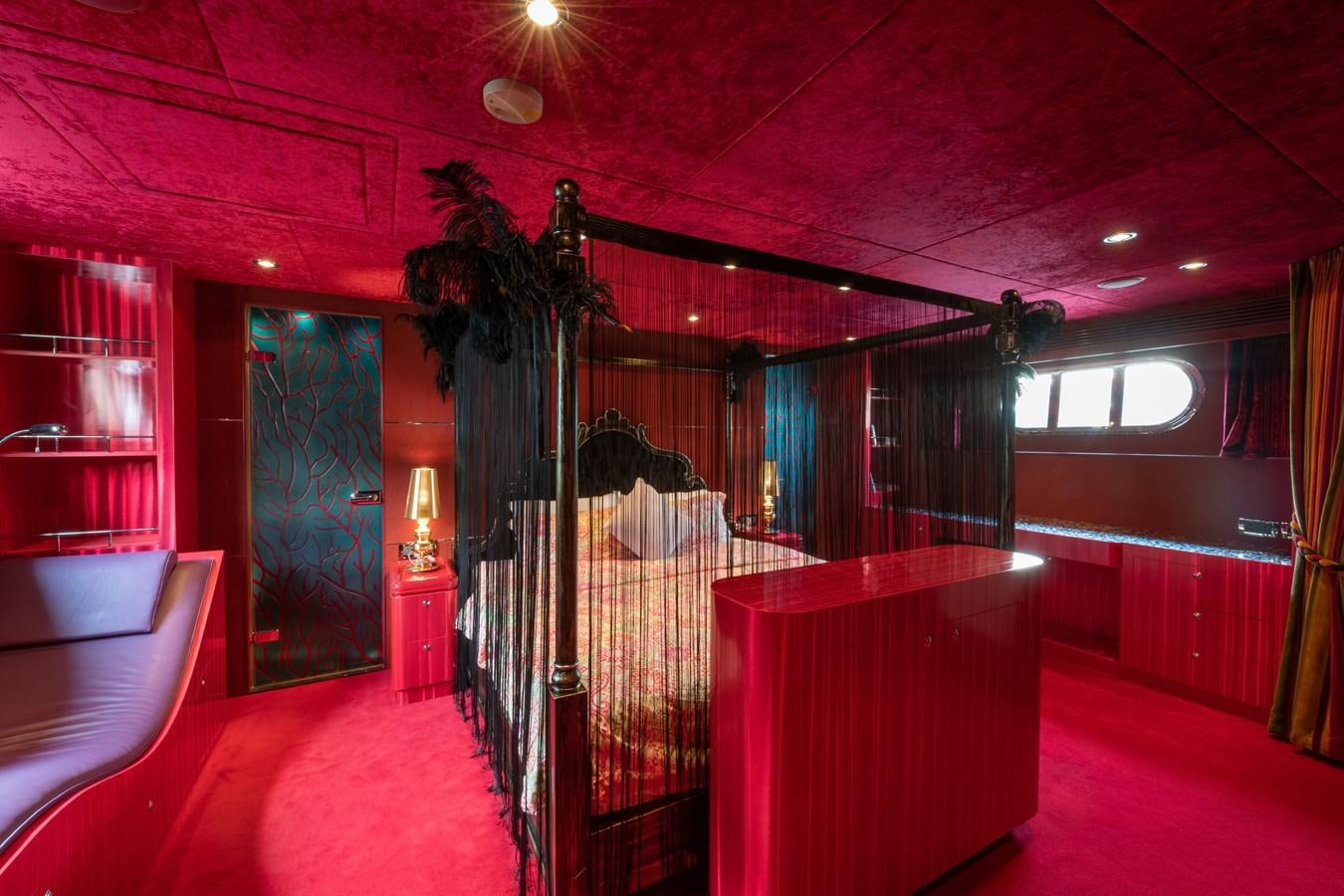 a room with red carpet and a pink carpet aboard VICTORIOUS Yacht for Charter