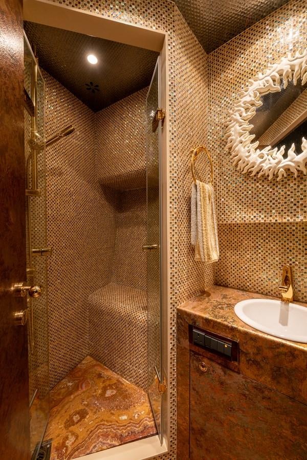a bathroom with a sink and a shower aboard VICTORIOUS Yacht for Charter