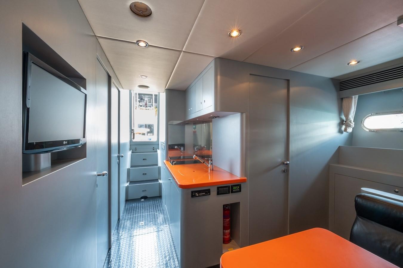 a kitchen with a large refrigerator aboard VICTORIOUS Yacht for Charter