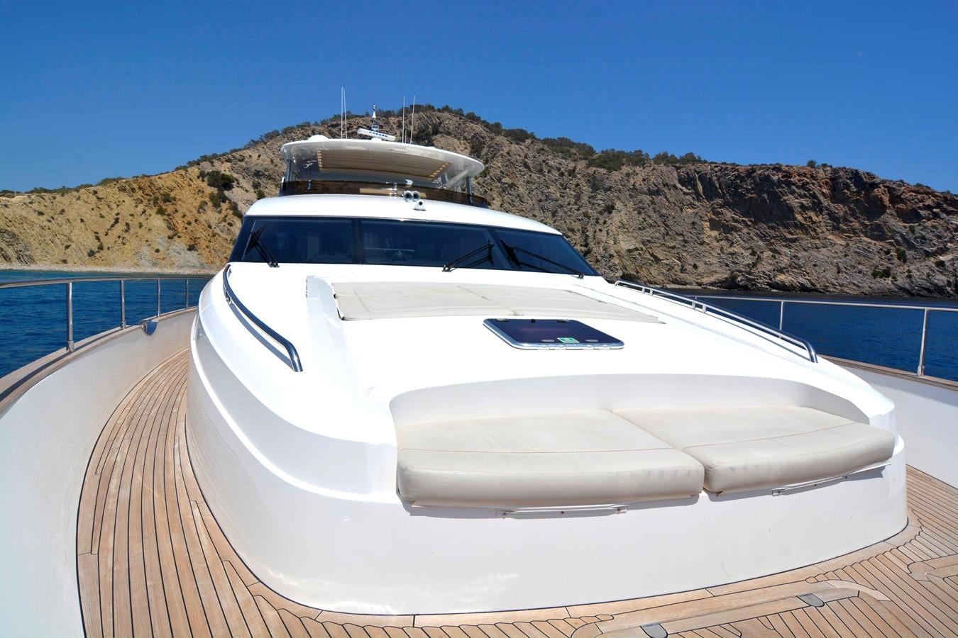 a white car on a dock aboard MAESTRO Yacht for Sale