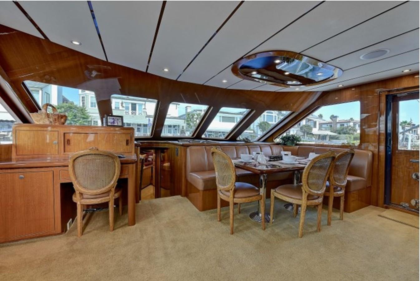 a room with a table and chairs aboard SVETI NIKOLA Yacht for Sale