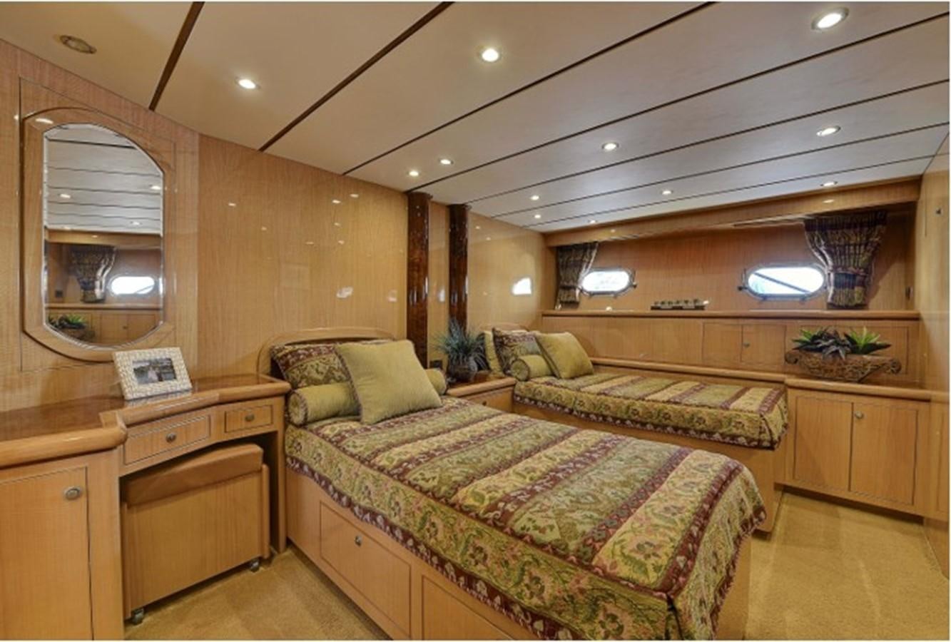 a bedroom with a bed and a desk aboard SVETI NIKOLA Yacht for Sale