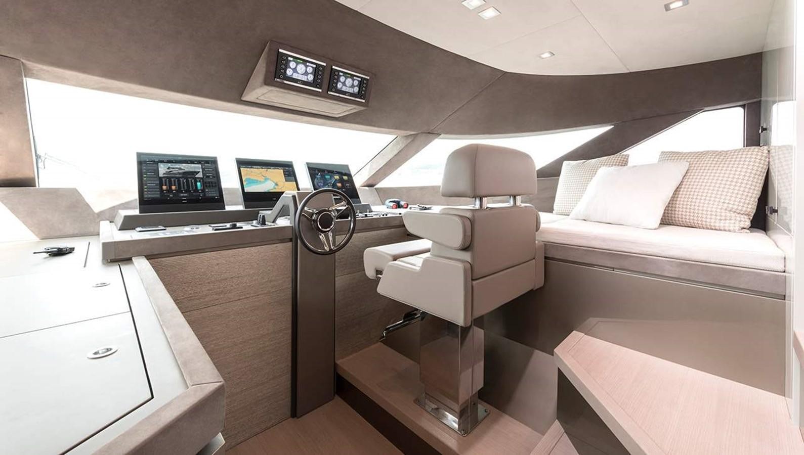 a room with a couch and a desk aboard MONTE CARLO YACHTS MCY 96 Yacht for Sale