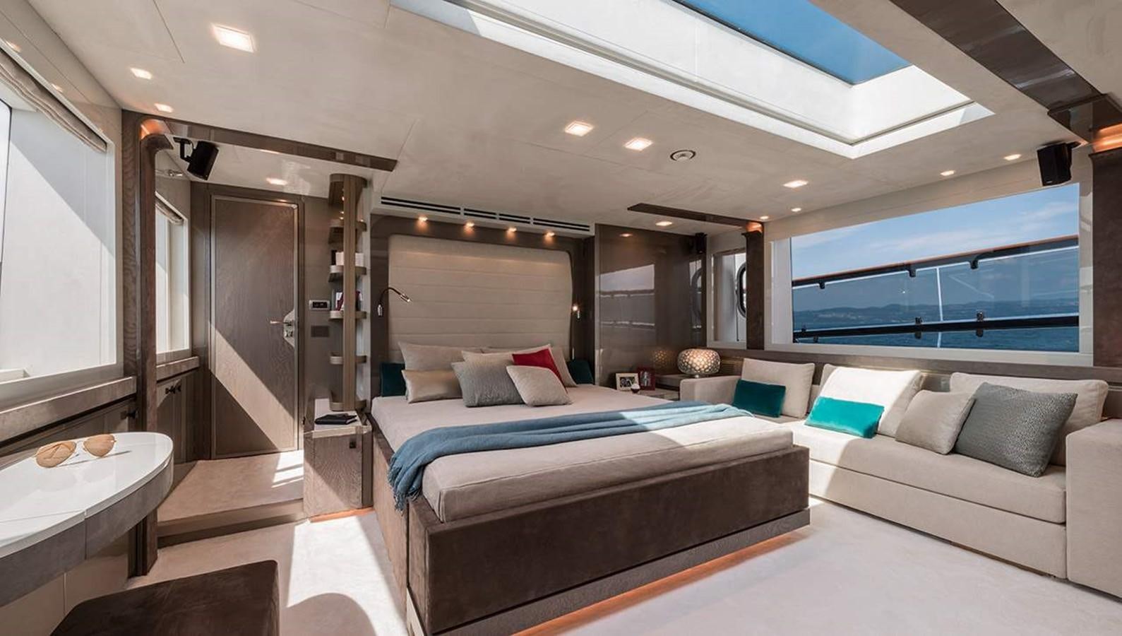 a room with a bed and a couch aboard MONTE CARLO YACHTS MCY 96 Yacht for Sale