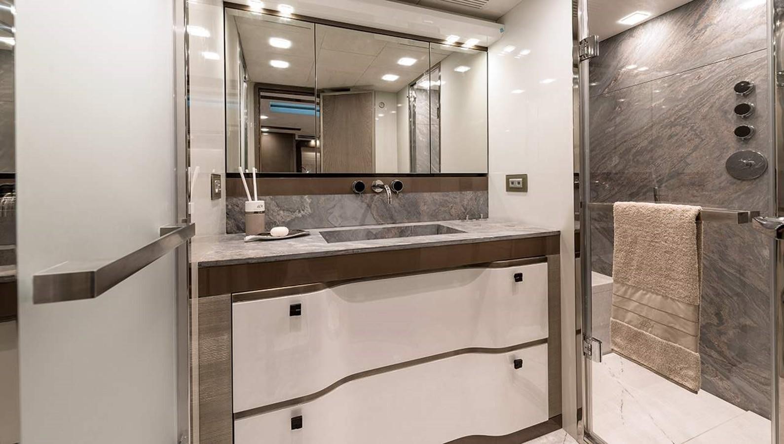 a bathroom with a large mirror aboard MONTE CARLO YACHTS MCY 96 Yacht for Sale