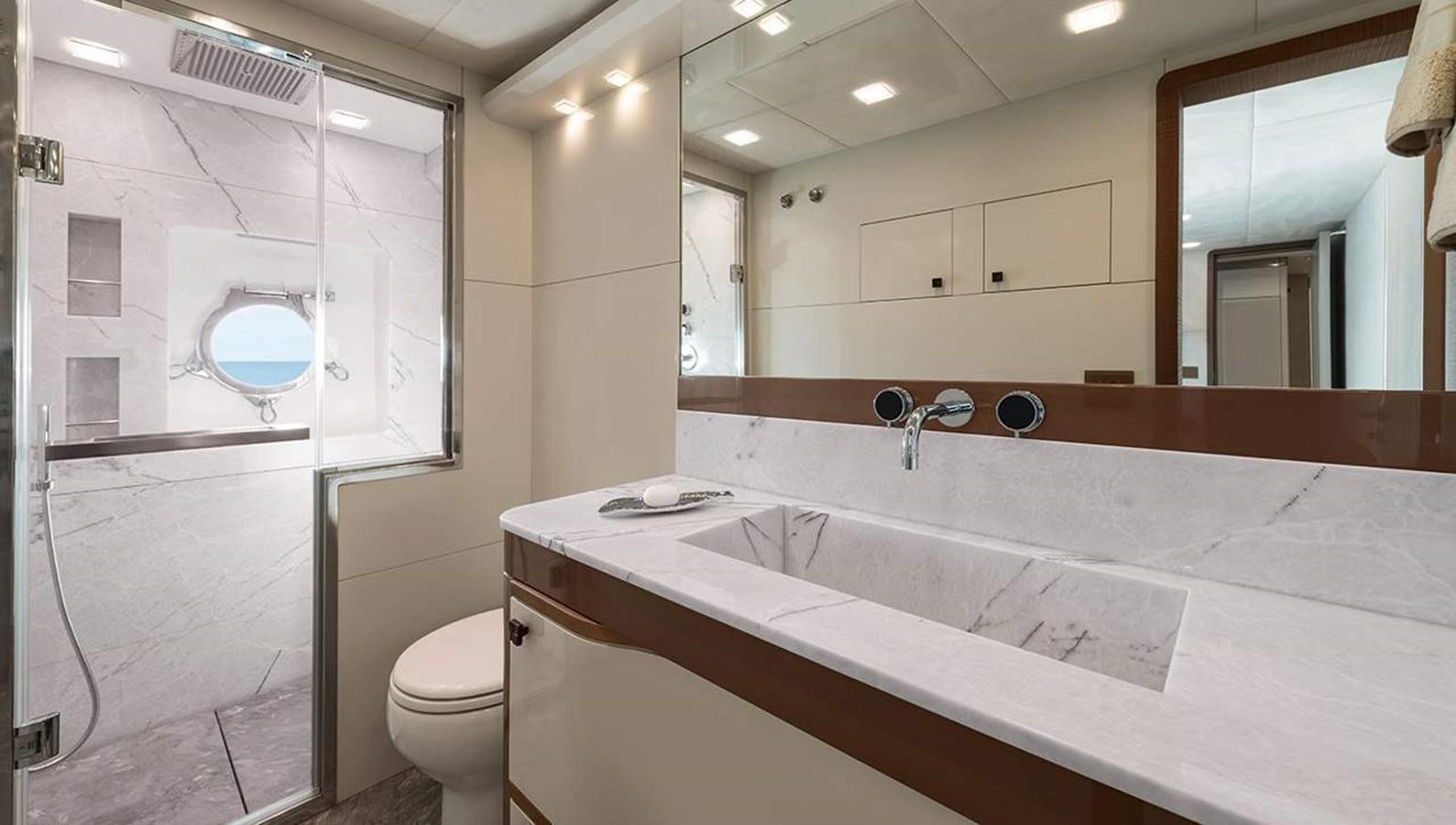 a bathroom with a large mirror aboard MONTE CARLO YACHTS MCY 96 Yacht for Sale