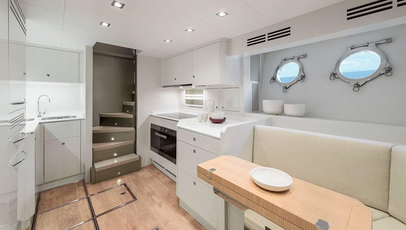 a kitchen with a large island aboard MONTE CARLO YACHTS MCY 96 Yacht for Sale