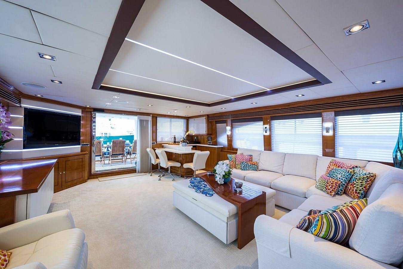 a living room with a large window aboard OSSUM DREAM Yacht for Sale