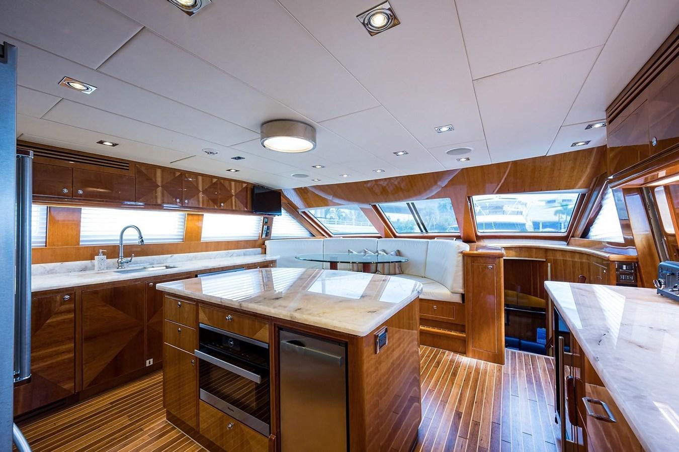 a large kitchen with a bar and bar aboard OSSUM DREAM Yacht for Sale