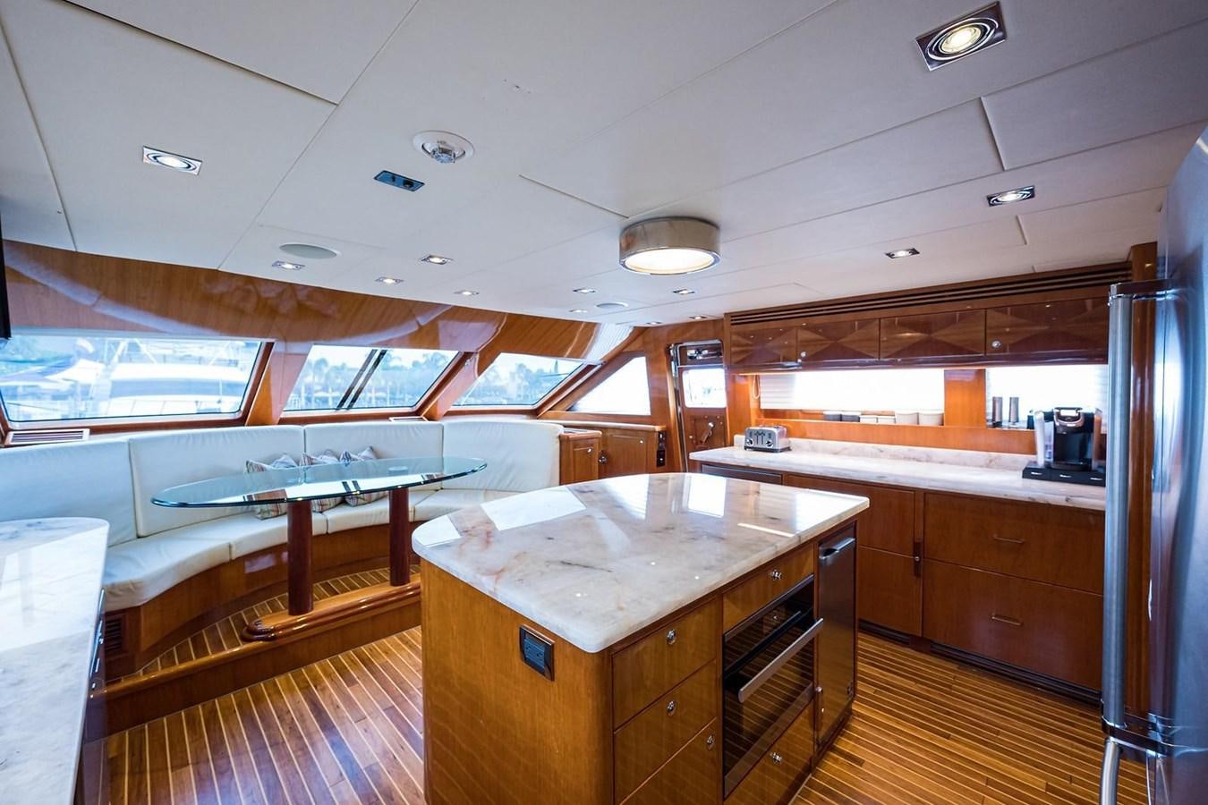 a large kitchen with a bar and pool table aboard OSSUM DREAM Yacht for Sale