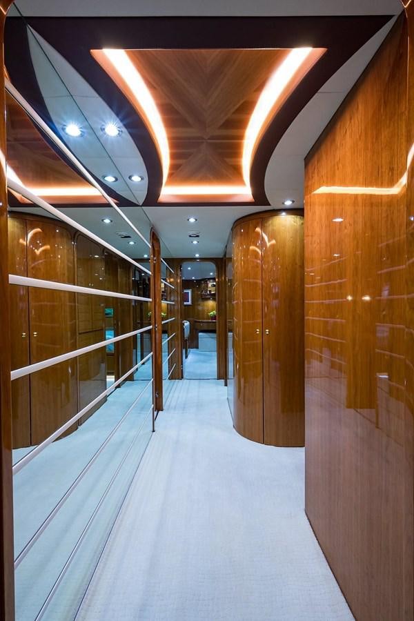 a hallway with glass doors aboard OSSUM DREAM Yacht for Sale