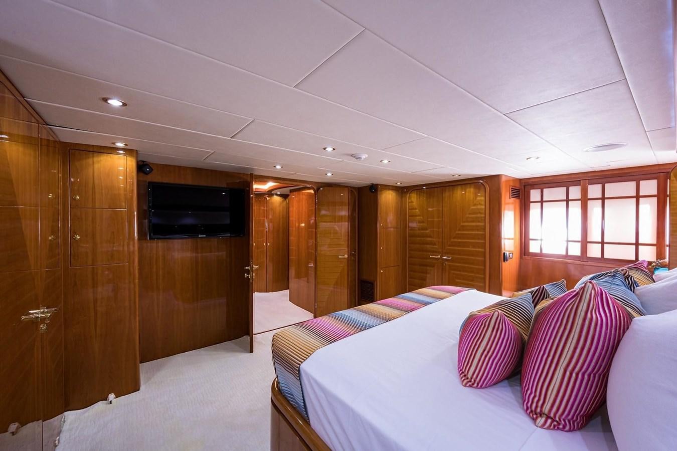 a room with a bed and a television aboard OSSUM DREAM Yacht for Sale
