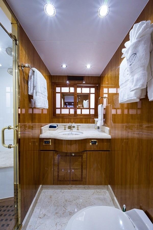 a bathroom with a sink and a mirror aboard OSSUM DREAM Yacht for Sale
