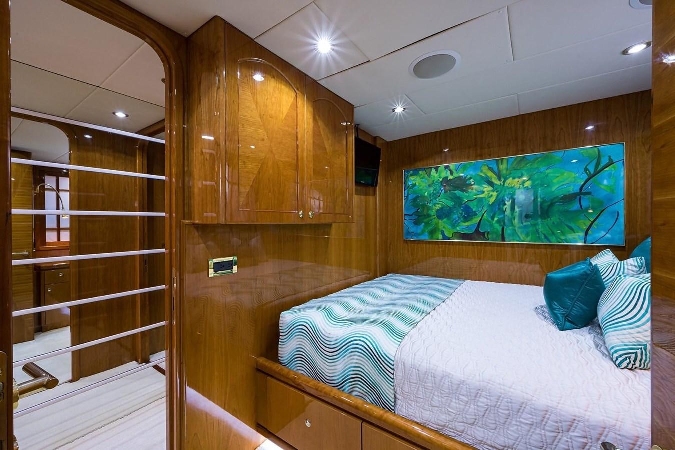 a room with a bed and a glass door aboard OSSUM DREAM Yacht for Sale