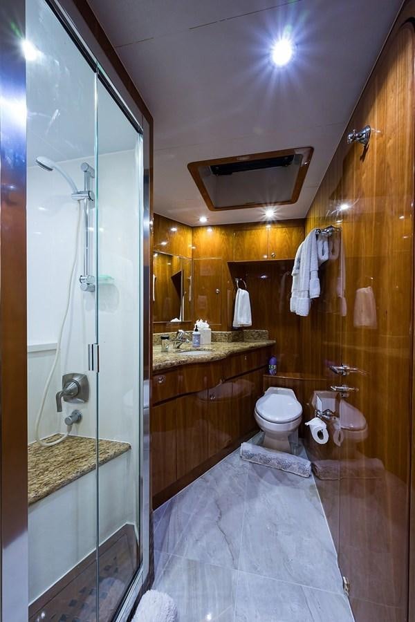 a bathroom with a glass shower aboard OSSUM DREAM Yacht for Sale