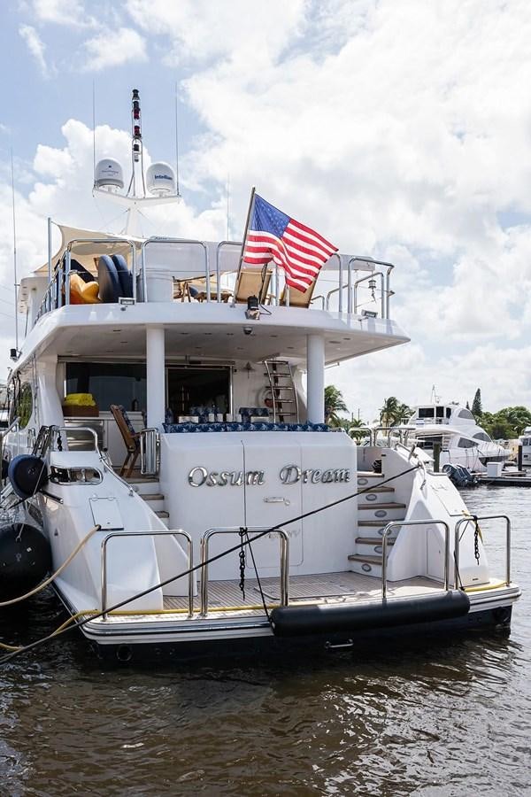 a boat with a flag on the front aboard OSSUM DREAM Yacht for Sale