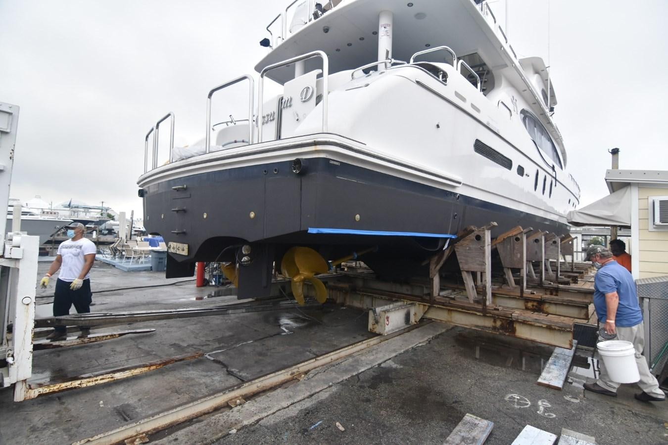 a large white ship on a trailer aboard OSSUM DREAM Yacht for Sale