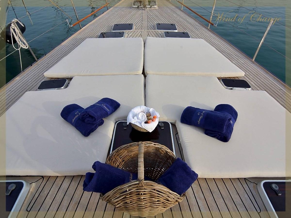 a boat with a table and chairs on it aboard WIND OF CHANGE Yacht for Sale