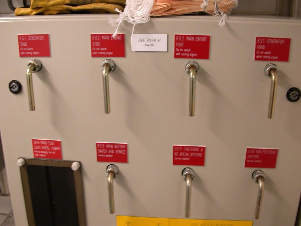 a wall with a few faucets and signs on it aboard MAVERICK Yacht for Sale