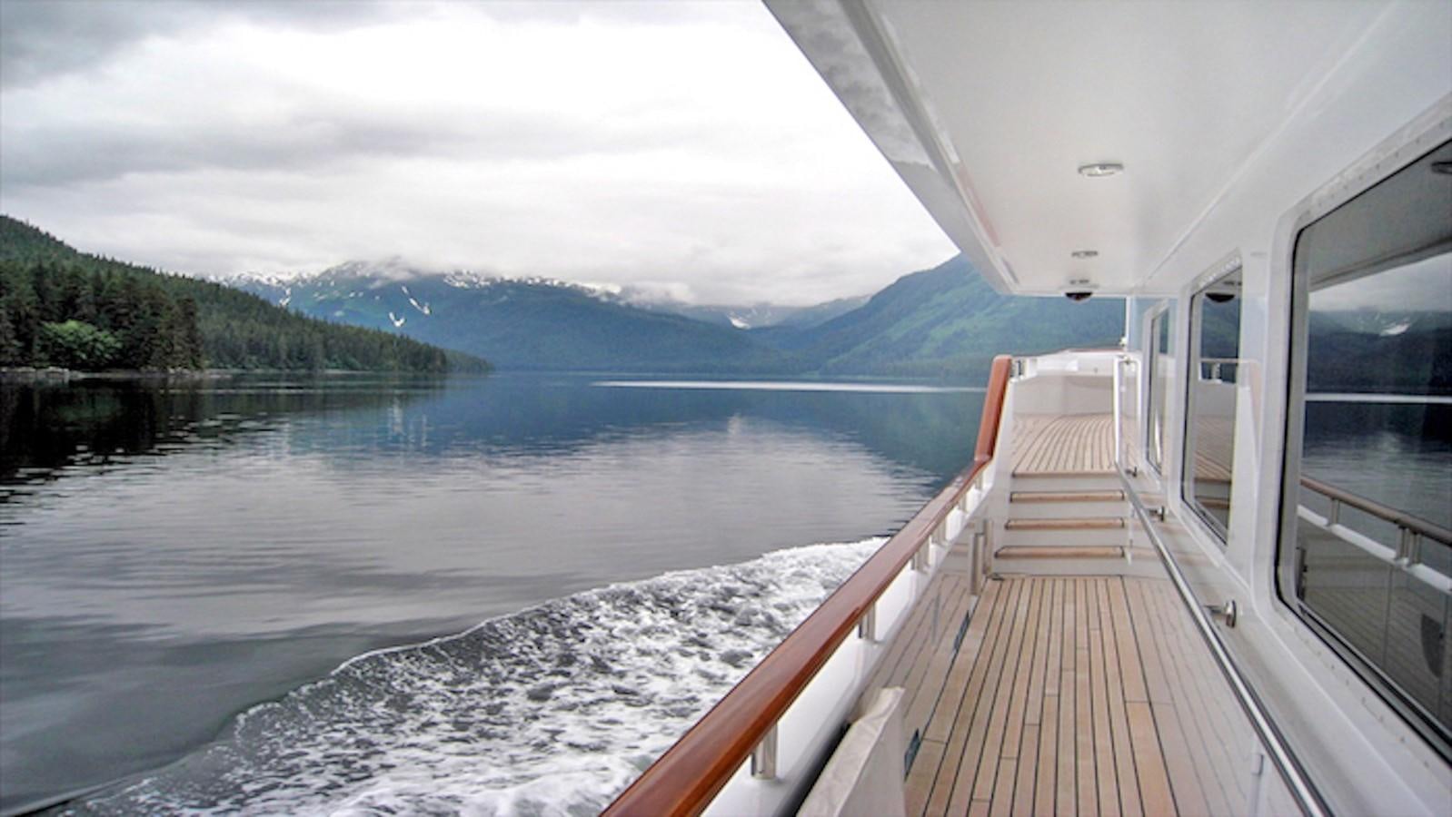 a wooden walkway over a body of water aboard MAVERICK Yacht for Sale
