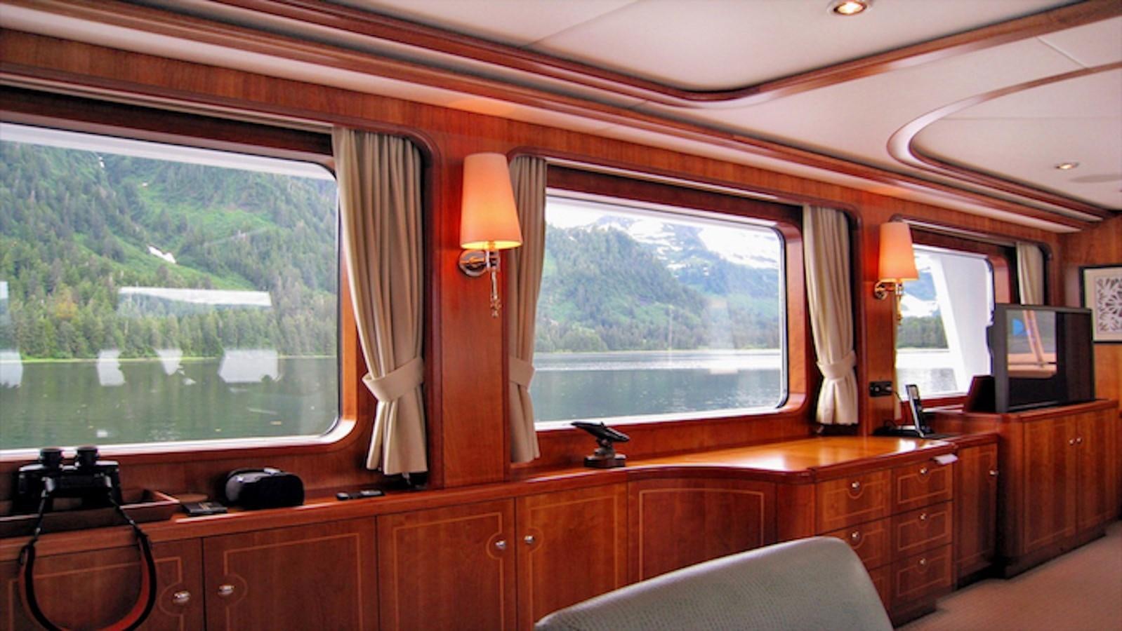 a room with a desk and a window aboard MAVERICK Yacht for Sale