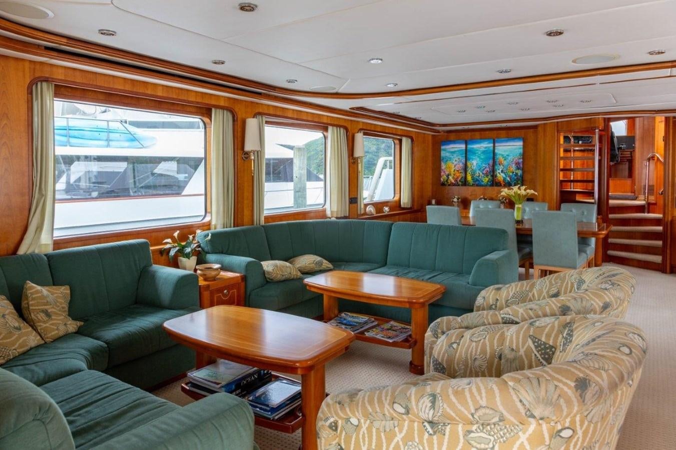 a living room with a couch and a coffee table aboard MAVERICK Yacht for Sale