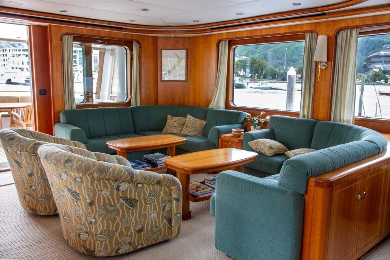 a living room with a couch and a coffee table aboard MAVERICK Yacht for Sale