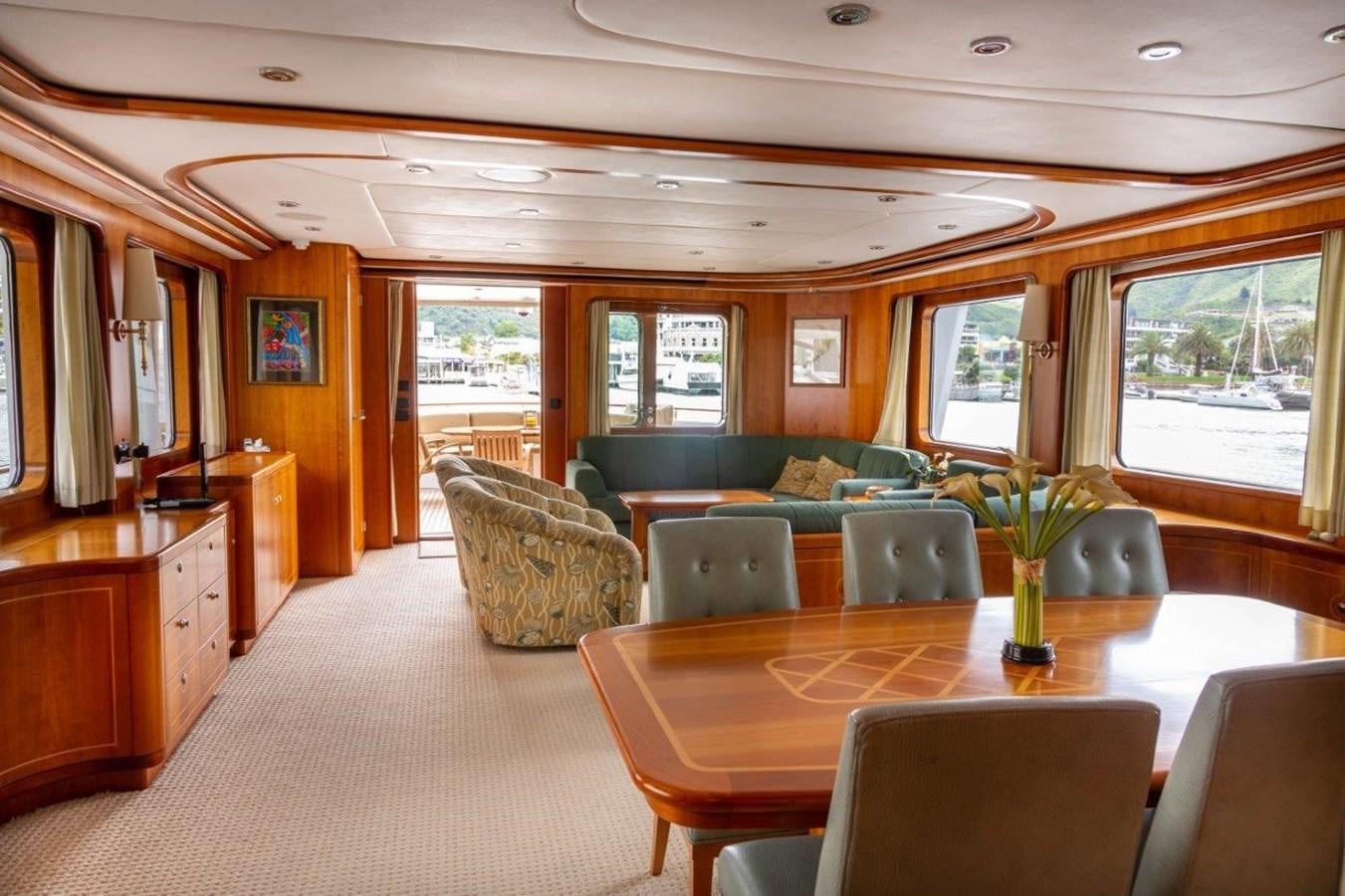 a living room with a couch and a table aboard MAVERICK Yacht for Sale
