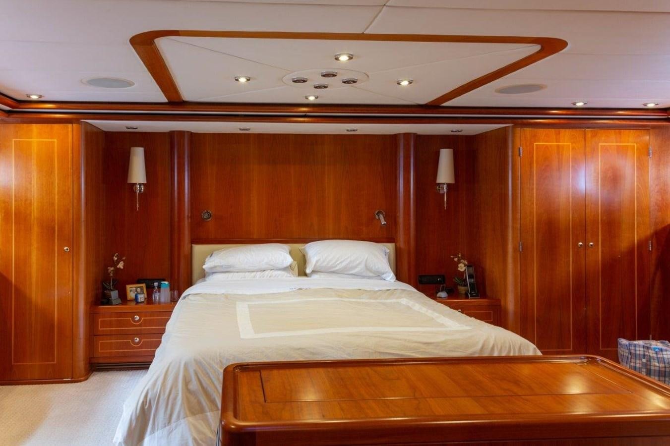 a room with a couple of beds aboard MAVERICK Yacht for Sale