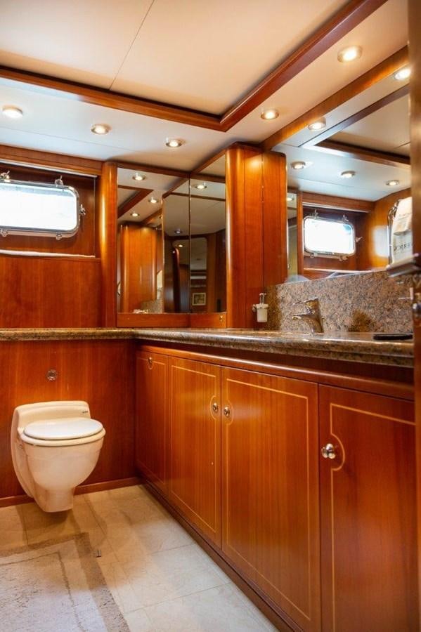 a bathroom with a large mirror aboard MAVERICK Yacht for Sale