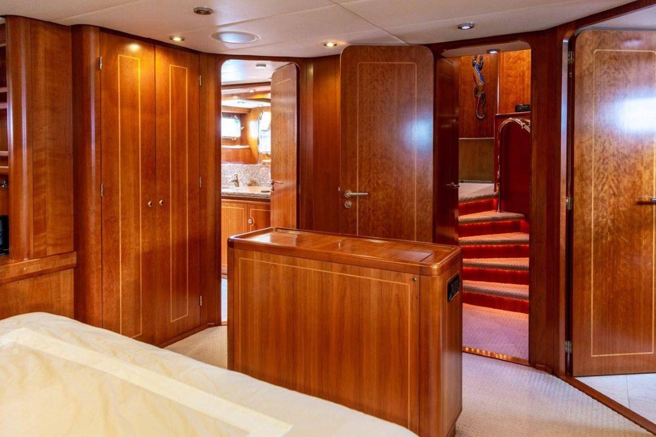 a room with wooden cabinets aboard MAVERICK Yacht for Sale