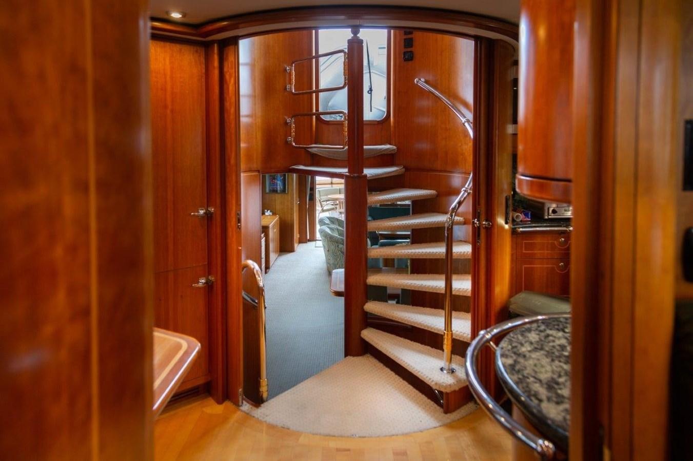 a room with a staircase and a door aboard MAVERICK Yacht for Sale