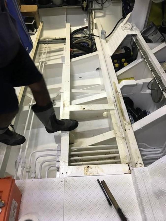 a person working on a machine aboard MAVERICK Yacht for Sale