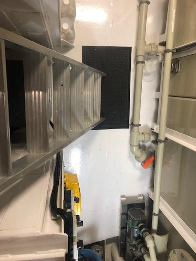 a room with pipes and equipment aboard MAVERICK Yacht for Sale