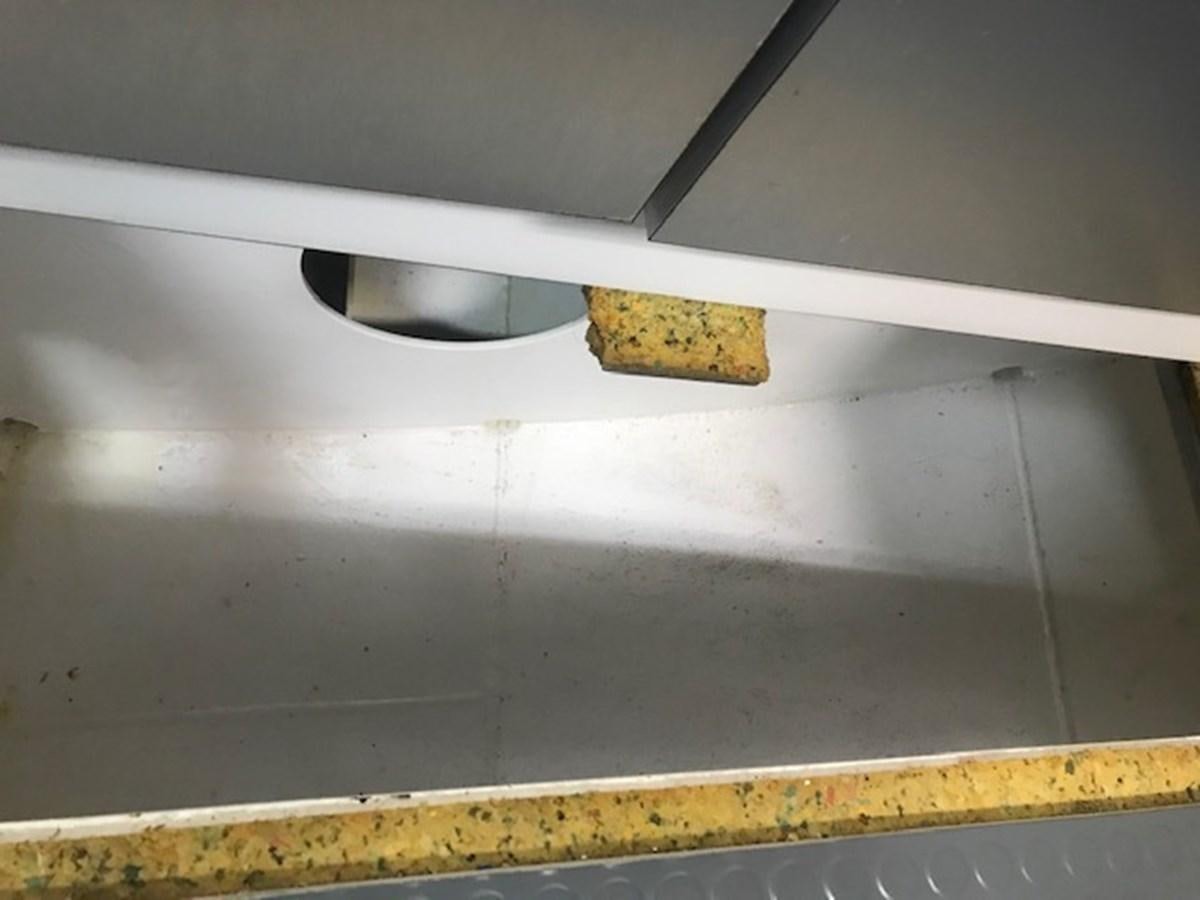 a white object with a black handle aboard MAVERICK Yacht for Sale