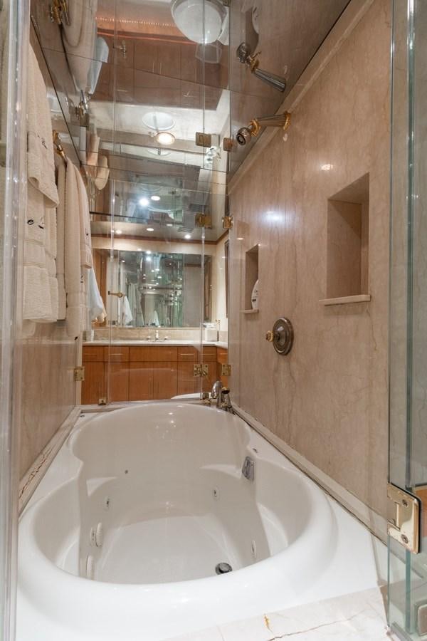 a bathroom with a large bathtub aboard CARPE DIEM Yacht for Sale