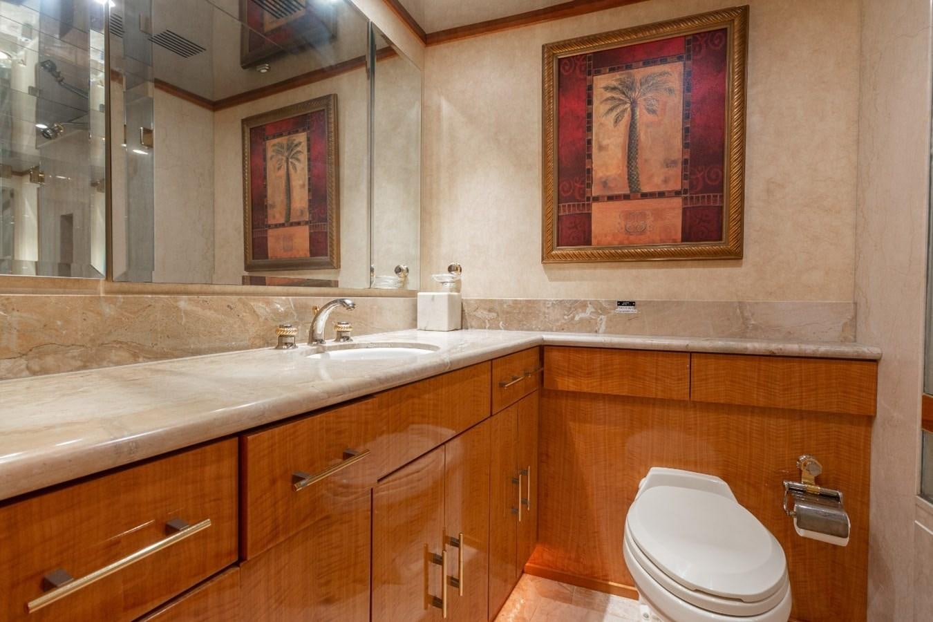 a bathroom with a toilet and sink aboard CARPE DIEM Yacht for Sale