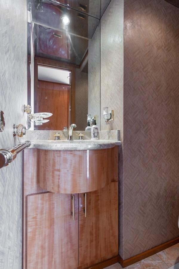 a bathroom with a sink and a mirror aboard CARPE DIEM Yacht for Sale