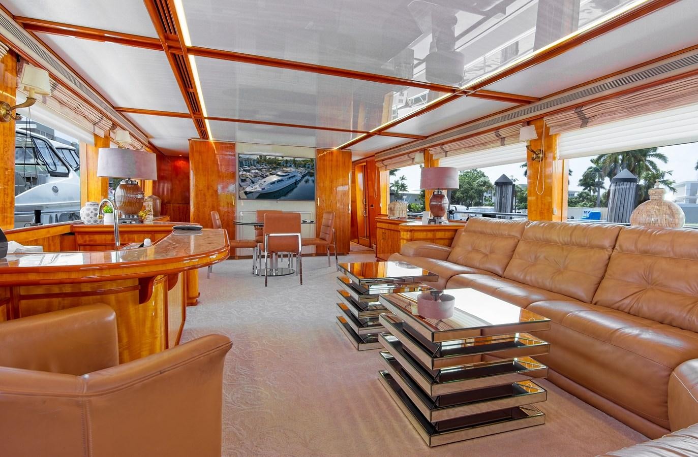 a living room with a large window aboard CARPE DIEM Yacht for Sale