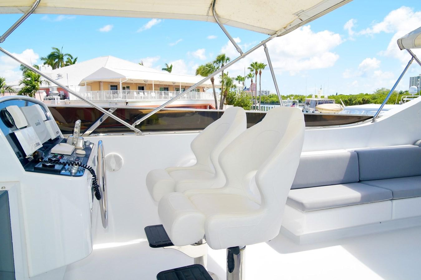 a white chair on a boat aboard CARPE DIEM Yacht for Sale