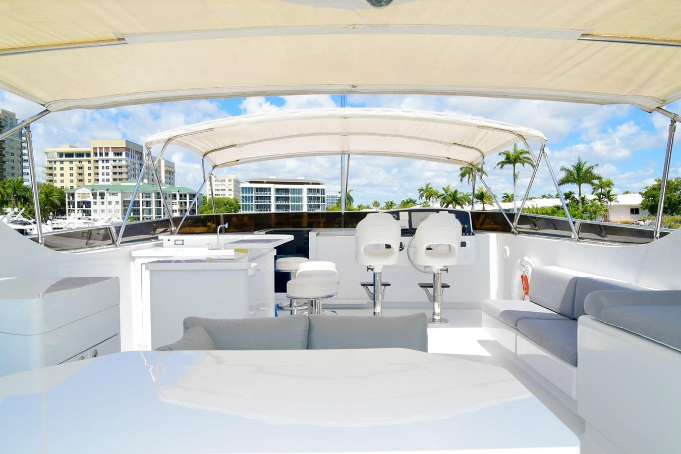 a room with a large white building and a large glass window aboard CARPE DIEM Yacht for Sale